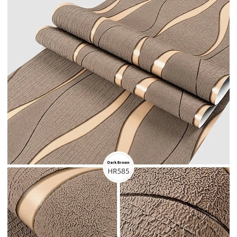 Roll of grey 3D stripe wallpaper with thick velvet texture next to a sample on a wall