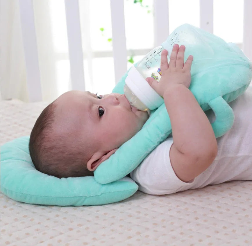 Plush confinement baby feeding pillow in soft colours, measuring 30cm by 42cm.