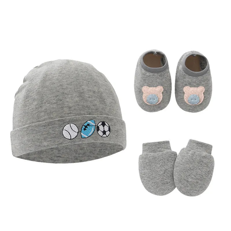 Set of white, light blue, and grey cotton baby pullover caps, gloves, and foot covers for infants.