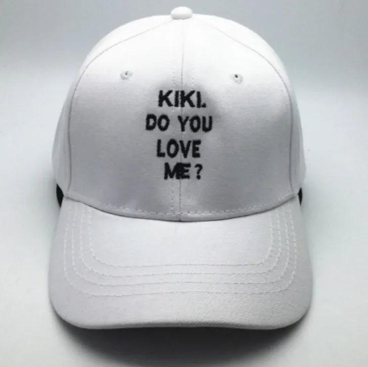 Letter embroidered cotton baseball cap in black with curved brim on white background