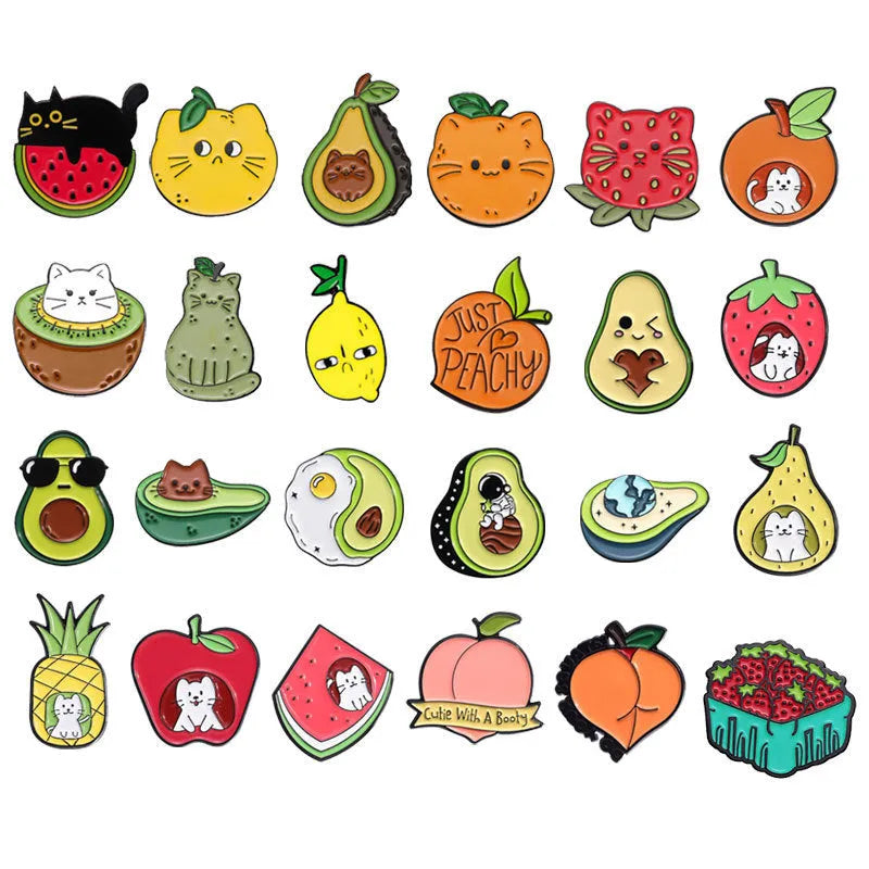 Colourful cartoon-style fruit metal brooch with pin clasp on a denim jacket lapel.