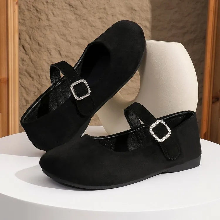 Women's solid black low-top canvas fisherman shoes with a flat rubber sole.