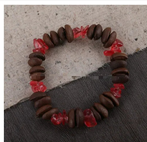 Handmade coffee bean bracelet with 16mm geometric charm showing colour variations