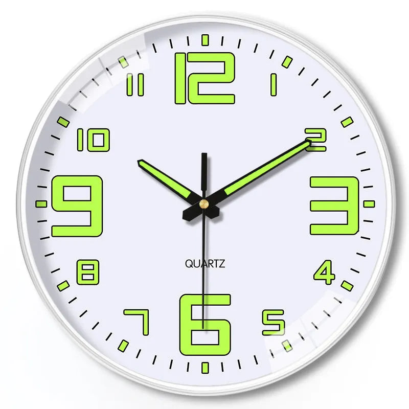 Modern 8 inch luminous wall clock in plastic case on a wall.