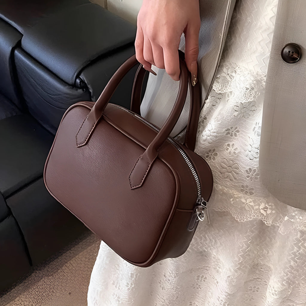 Small square retro messenger bag in black or coffee colour with single shoulder strap