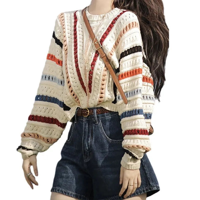 Multicolour rainbow striped women's sweater with batwing sleeves and a loose round neck fit.