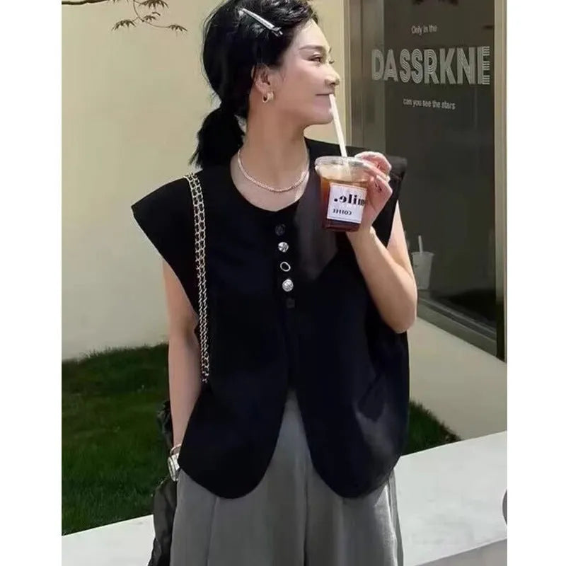 Women's loose fit polyester vest in milky white with pockets, shown on a hanger.