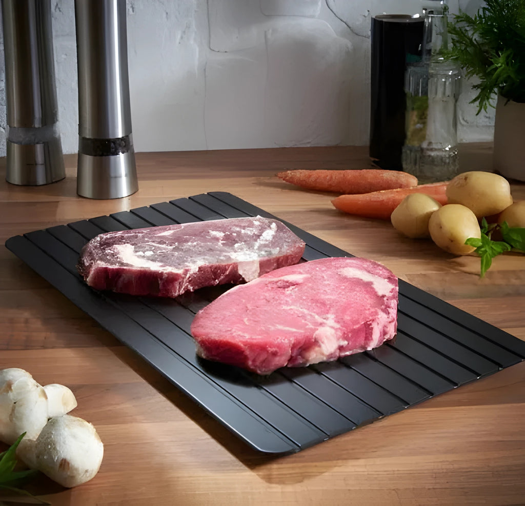 Black aluminium defrosting tray for thawing frozen meat without microwave