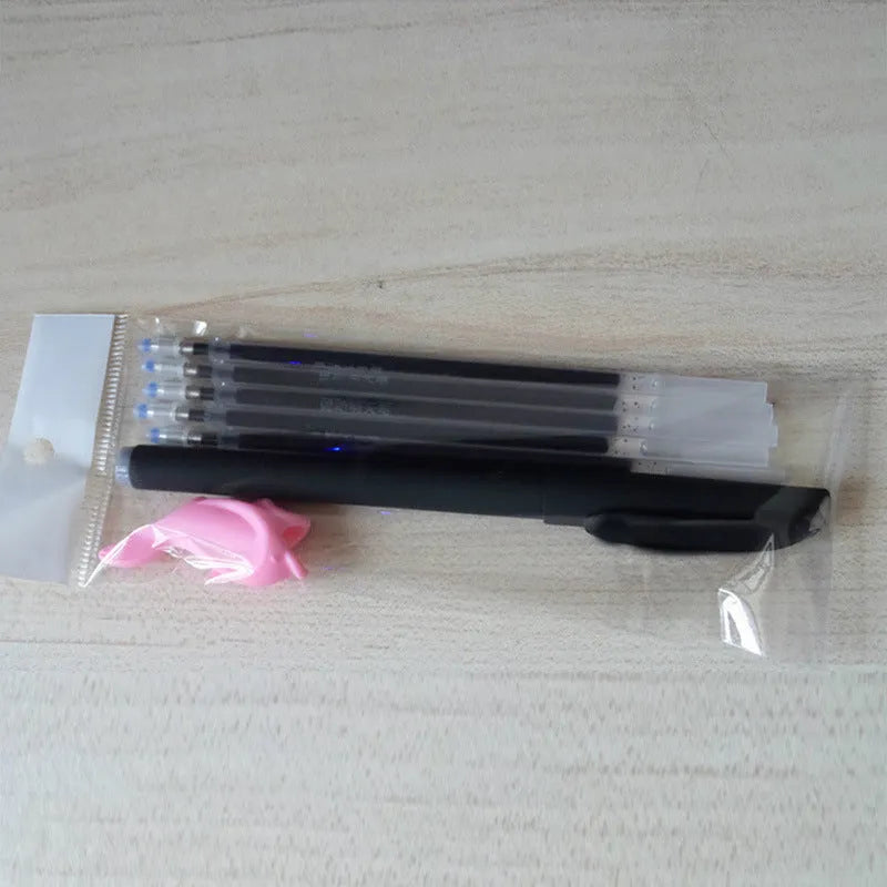 Automatic fade and disappear pen set with clear plastic holder and eight refill cartridges.