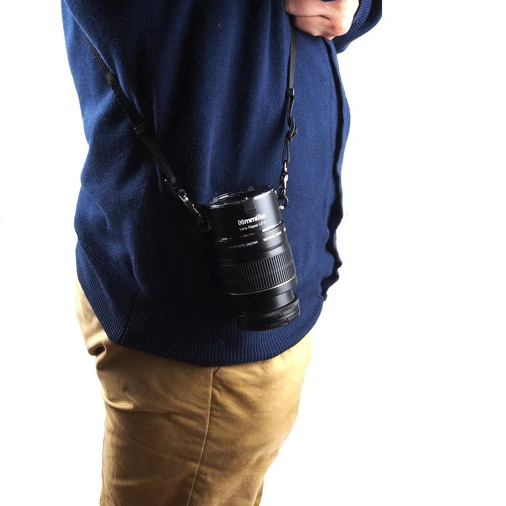 Aluminium alloy Nikon E-Mount camera lens flipper dual holder with cotton shoulder strap.