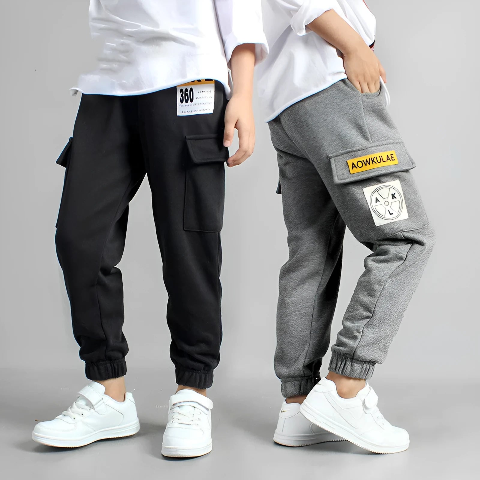 Boys' cotton track pants in black and grey, sizes 120-160cm, with elasticated hips