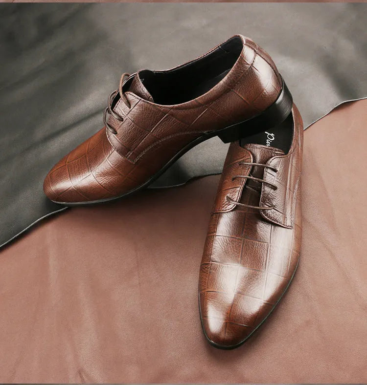 Men's black checkered leather derby shoes with a pointed toe and rubber sole on a white background.