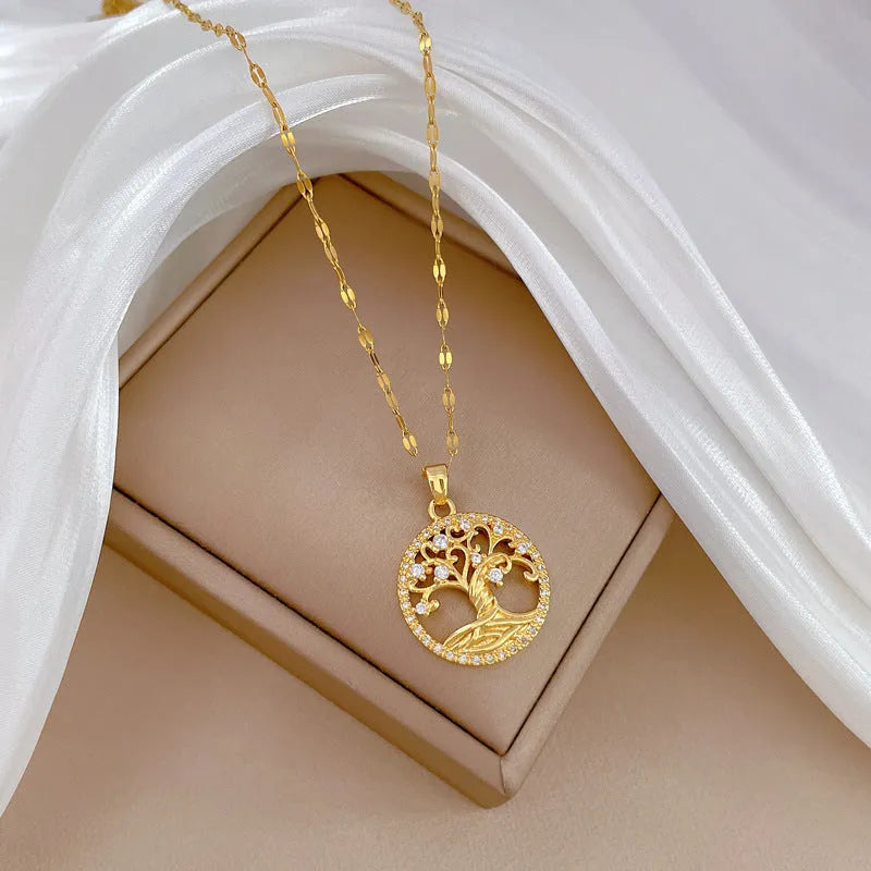 Gold-colour adjustable necklace with a mother-of-pearl pendant featuring a sparkling zircon lucky tree inlay.