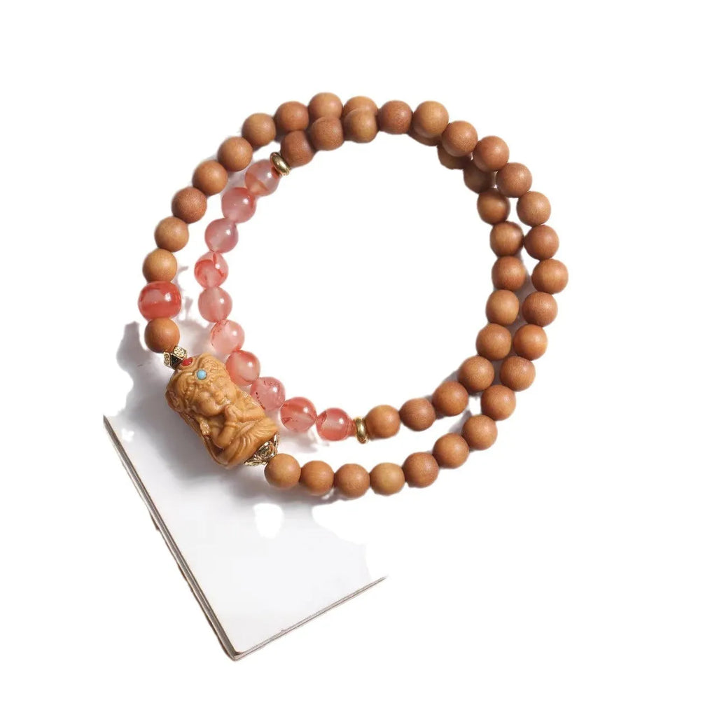 Brown wooden bracelet with South Red Zachilam double circle design showing 6mm round beads
