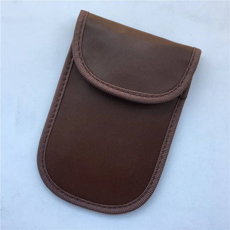 Black signal-blocking Faraday pouch for car key fobs, size 20x10 cm, lying flat on a surface