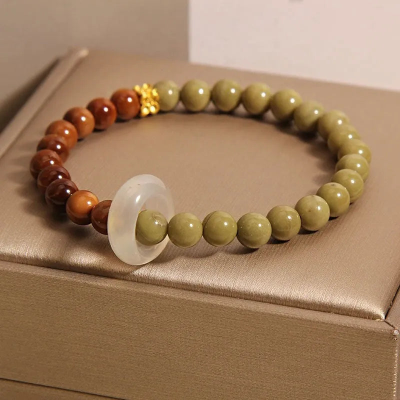 Green gradient women's bracelet with crown and geometric shapes in a Chinese style design