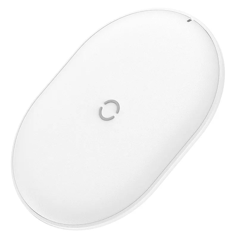 Baseus Rough 15W wireless charging pad in black on a table next to a mobile phone.