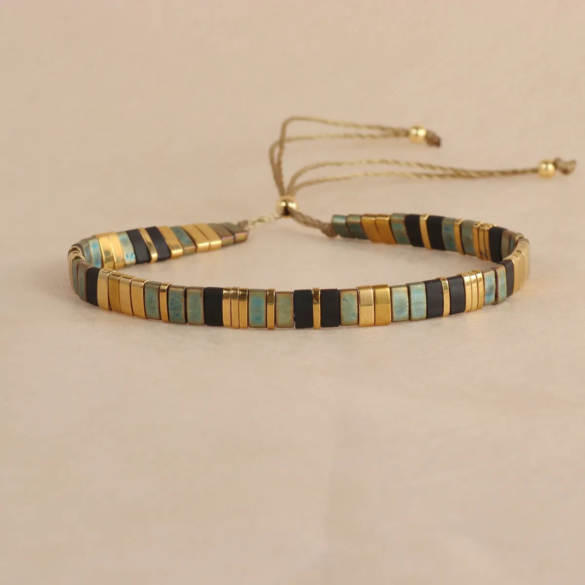 Geometric beaded bracelet with round glass and coloured glaze beads in five colour options.