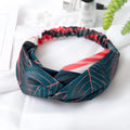 Red cloth headband with woven banana leaf design and cross hair pattern