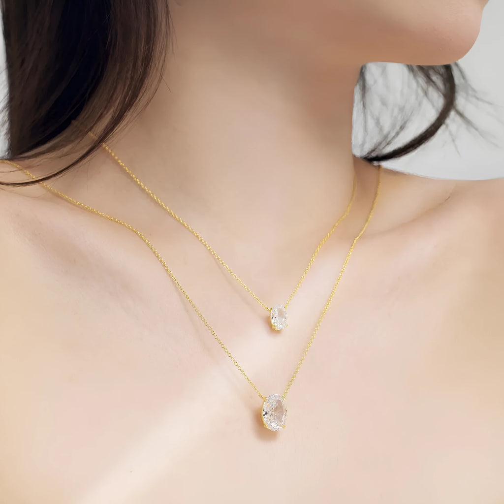 A sterling silver necklace with a geometric oval ice flower pendant on a chain.