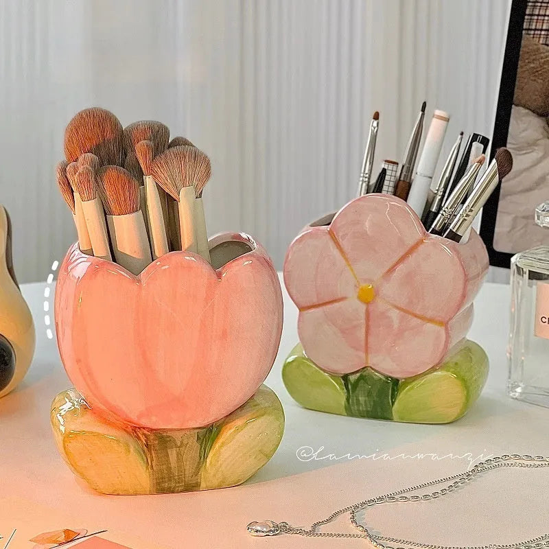Ceramic flower pen holder storage box in a floral design on a desk