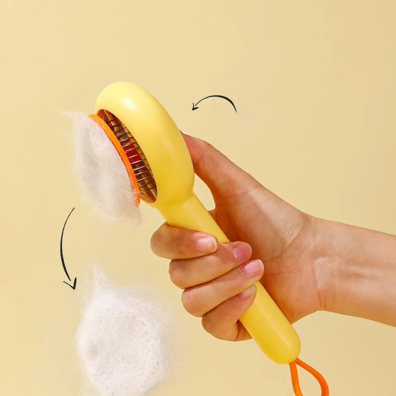 Small yellow duck-shaped pet comb for cat and dog grooming with open-section needle design