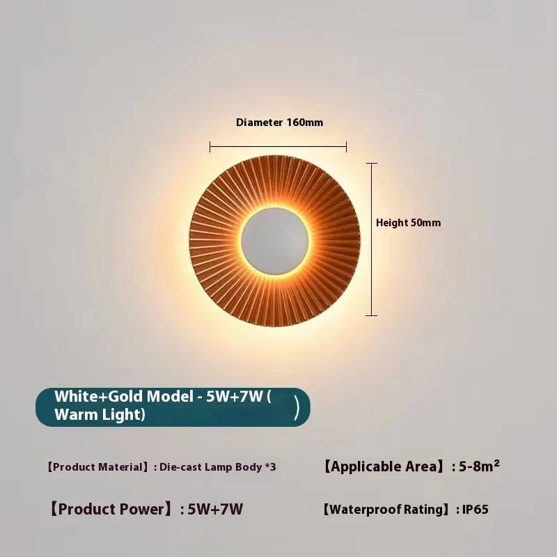 Round wall-mounted LED light with aluminium shade in a gold and white two-tone colour option.