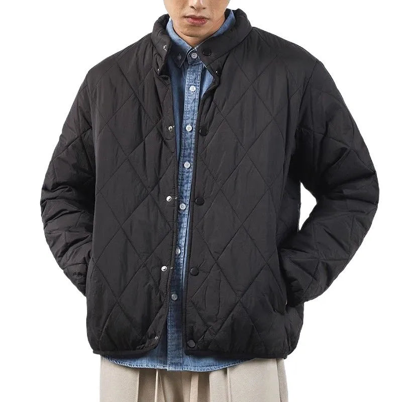 Men's black diamond lattice quilted winter jacket with extended length and loose fit.