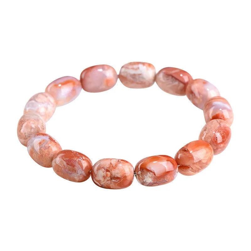 Natural cherry agate barrel bead bracelet with Ruyi symbols on a white background.