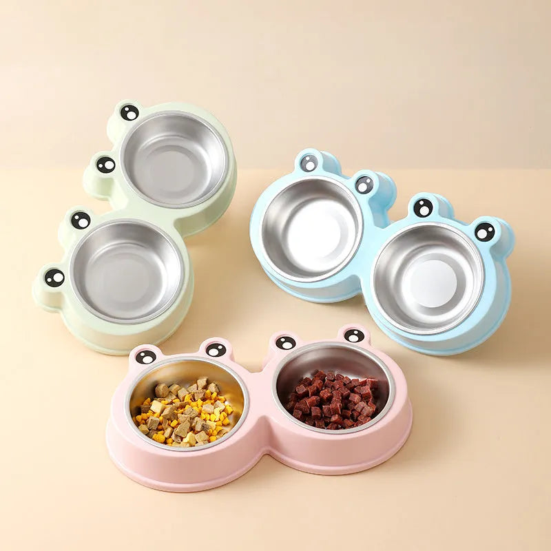 Stainless steel double compartment pet bowl for food and water on a silicone non-slip base.