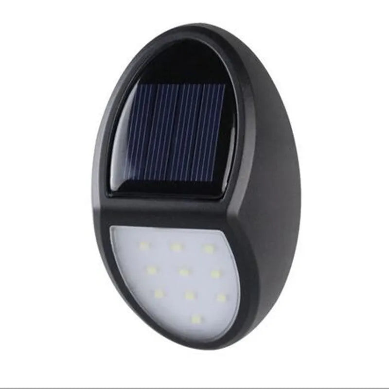 Black rectangular solar-powered LED wall light for outdoor garden use.