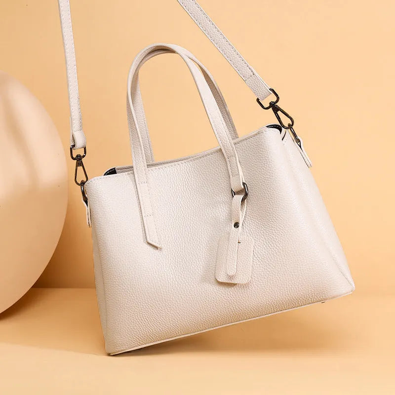 Women's genuine cowhide leather handbag in horizontal square shape with multiple internal compartments