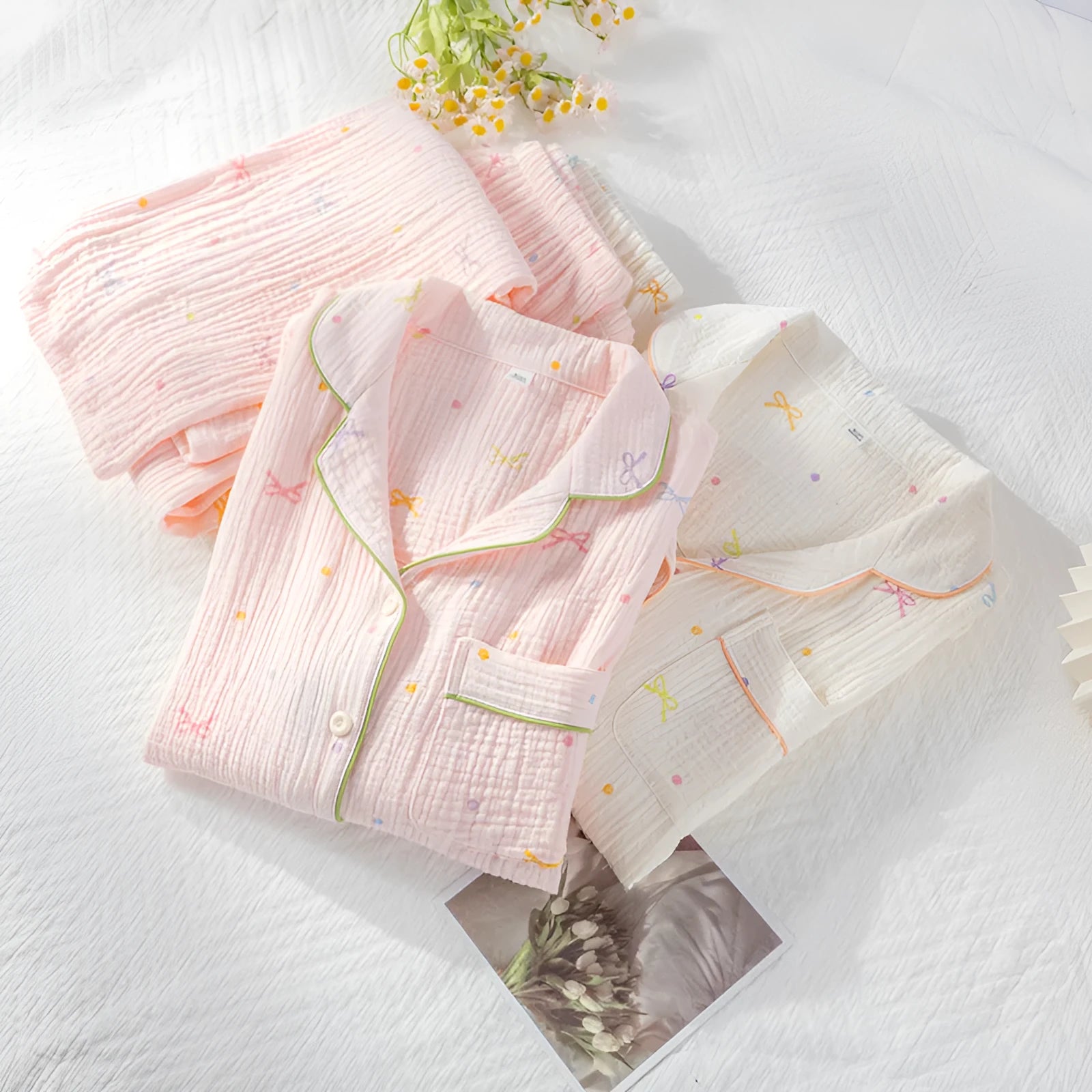 Women's cotton pajamas set in pink and beige colours showing long sleeves and trousers-length pants