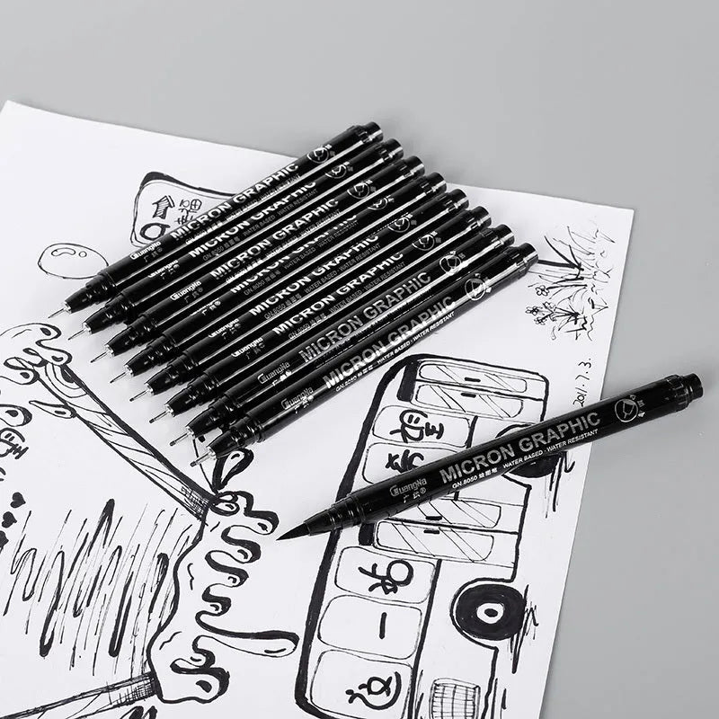Set of 12 black comic drawing pens with assorted microtip nibs in a fabric organiser pouch.