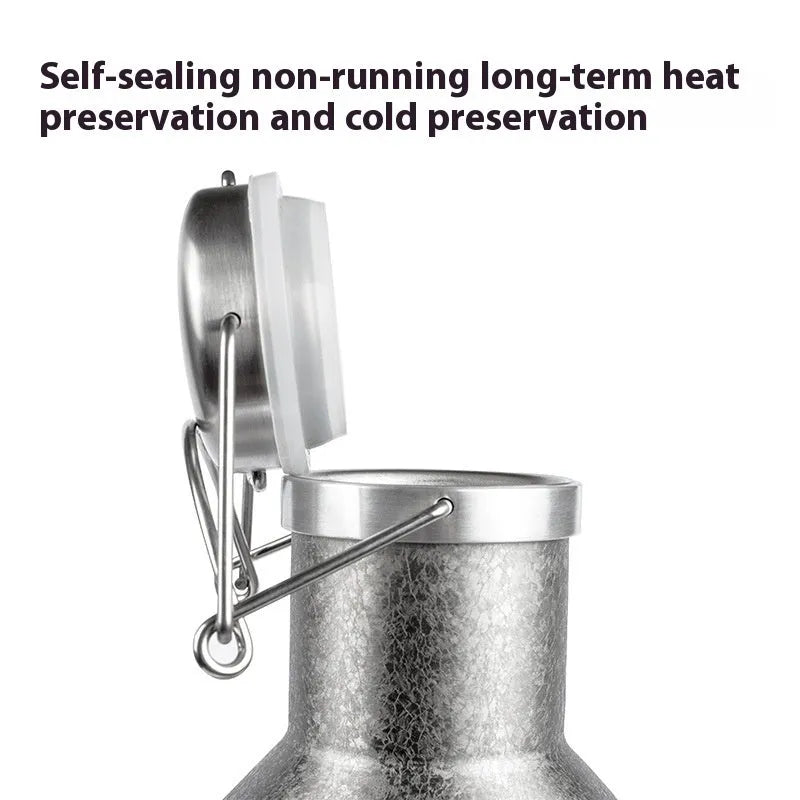 Large stainless steel outdoor thermal pot with a handle, shown in a natural setting.