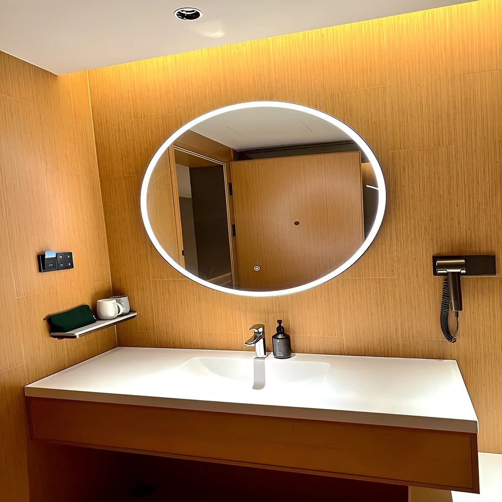 Round black aluminum frame smart bathroom mirror with integrated LED lighting on a wall.