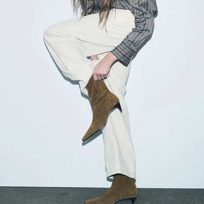 Brown square toe ankle boots with a side zip and a waterproof platform kitten heel.
