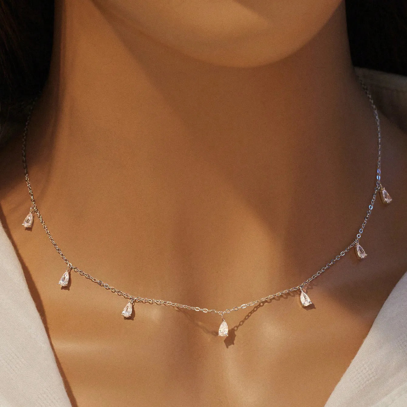 Gentle drop-shaped artificial zircon pendant on a silver O-chain necklace for women.