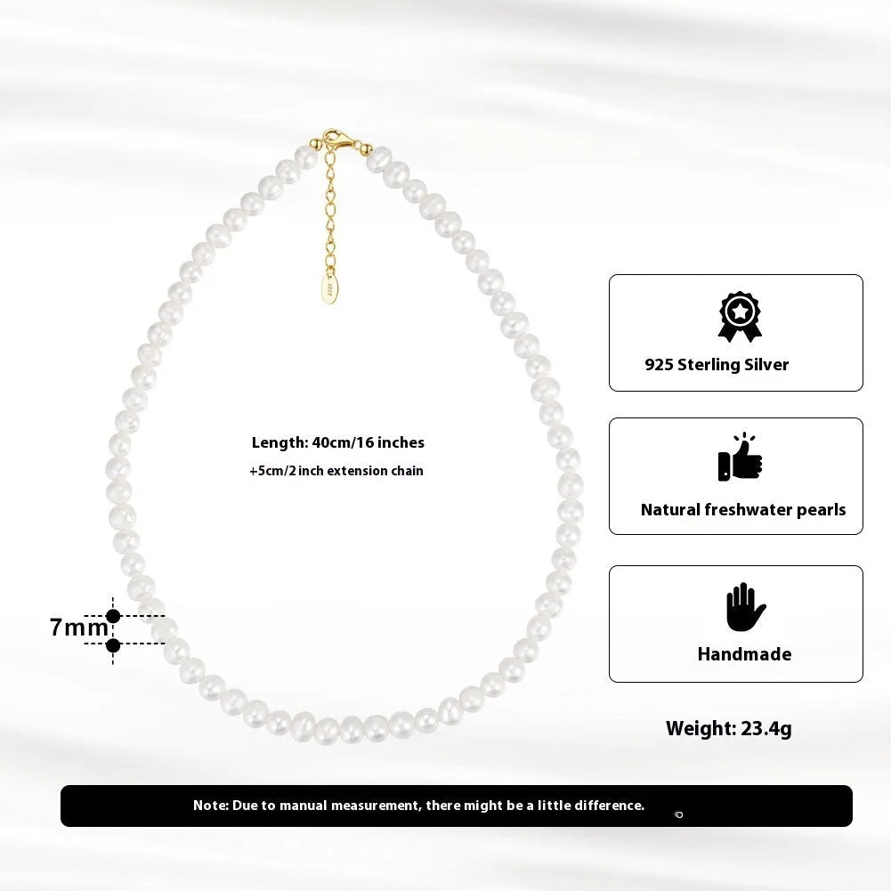 Close-up of a silver adjustable necklace with a single natural freshwater pearl pendant.