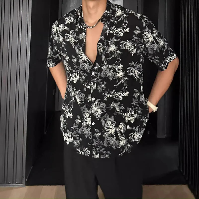 Loose fit short sleeve floral print shirt in white, shown on a hanger.