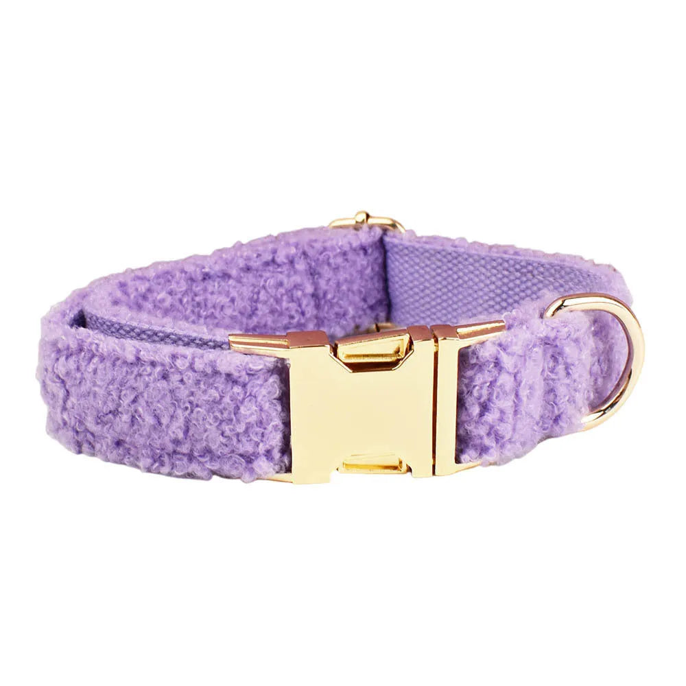 Purple cloth dog accessory set showing collar, leash, bow, and vest for small dogs
