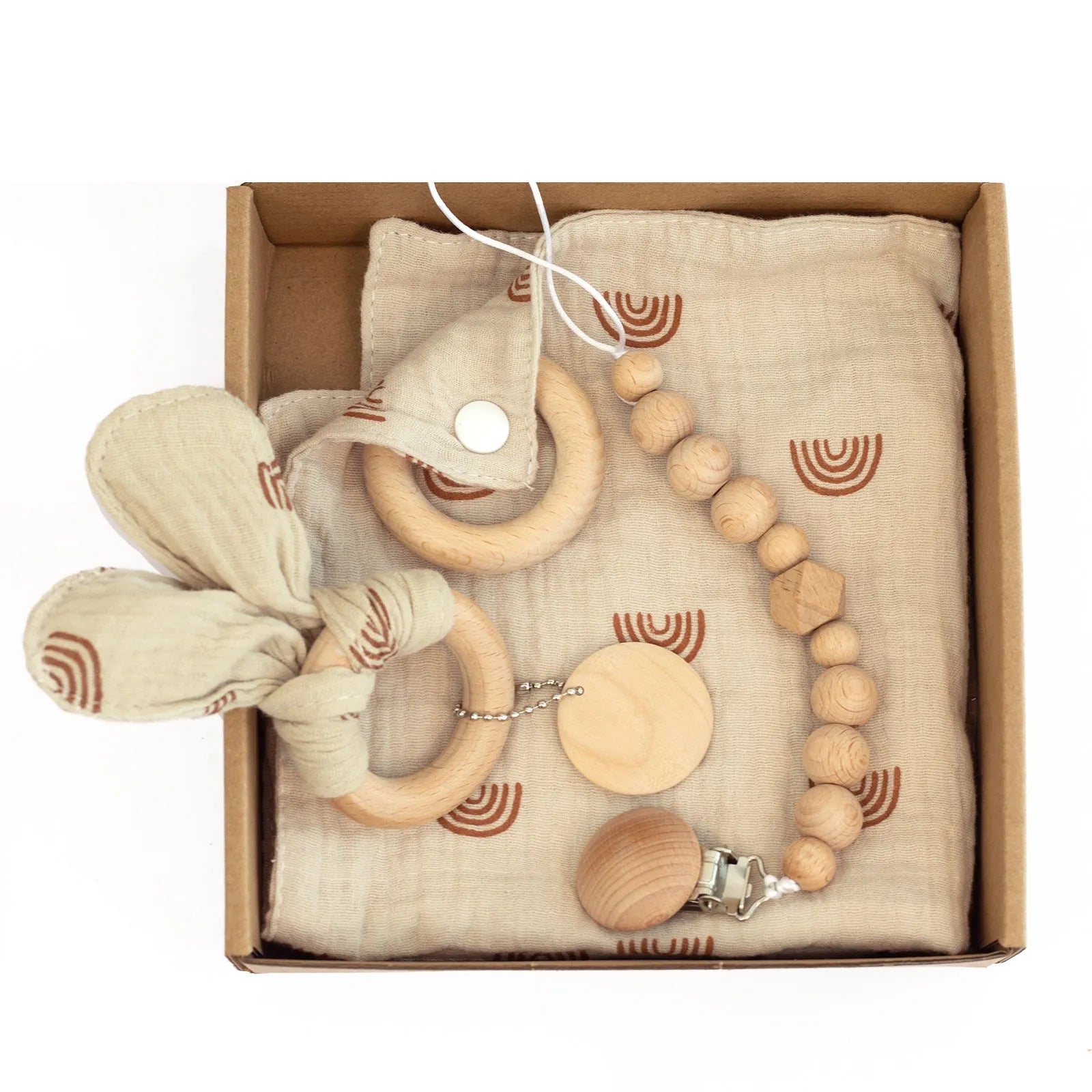 Baby teething toy gift set showing gauze blanket, wooden bell, gum teether, tire brush, and milestone on white background