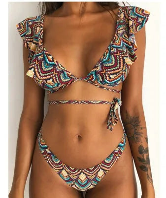 Yellow floral print split style bikini swimsuit on a mannequin.