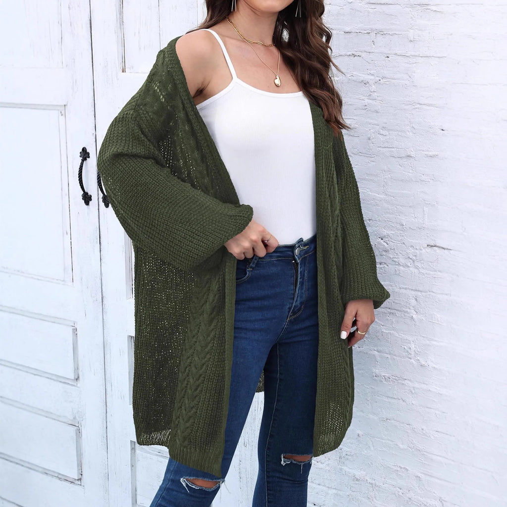 Women's loose longline acrylic cardigan sweater coat in a solid colour.