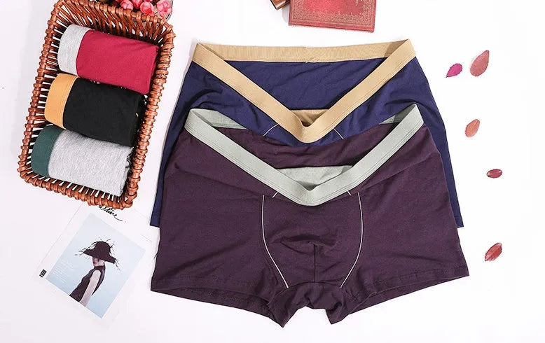 Men's oversized cotton baggy boxers in black, red, gray, blue and purple on a white background
