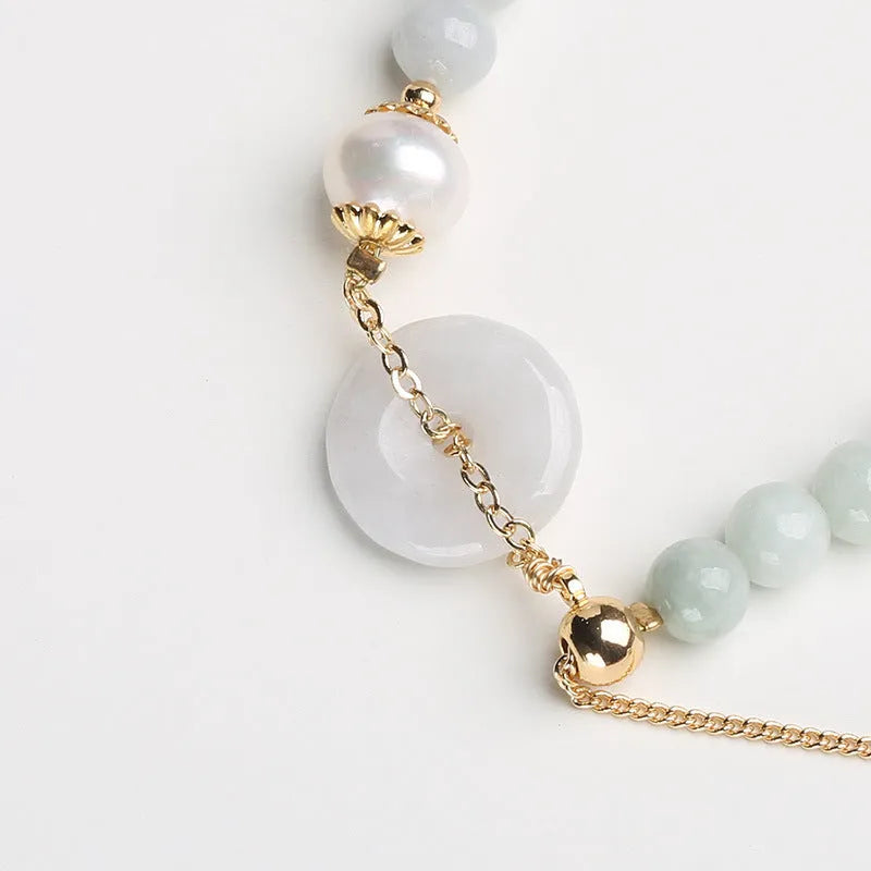 Natural jade peace buckle pearl bracelet with geometric pendant on wrist