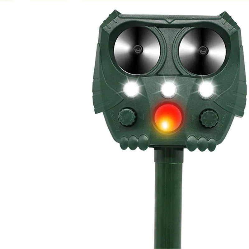 Green solar-powered ultrasonic animal repeller with motion sensor for outdoor pest control