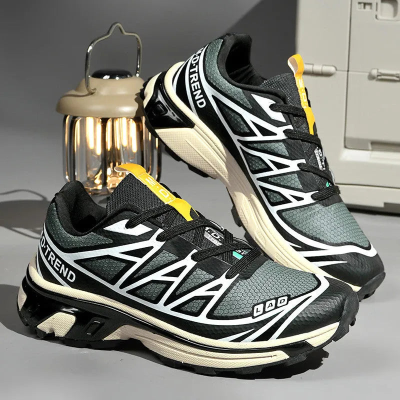 Men's and women's low-top outdoor hiking shoes in khaki with lace-up front and rubber sole.