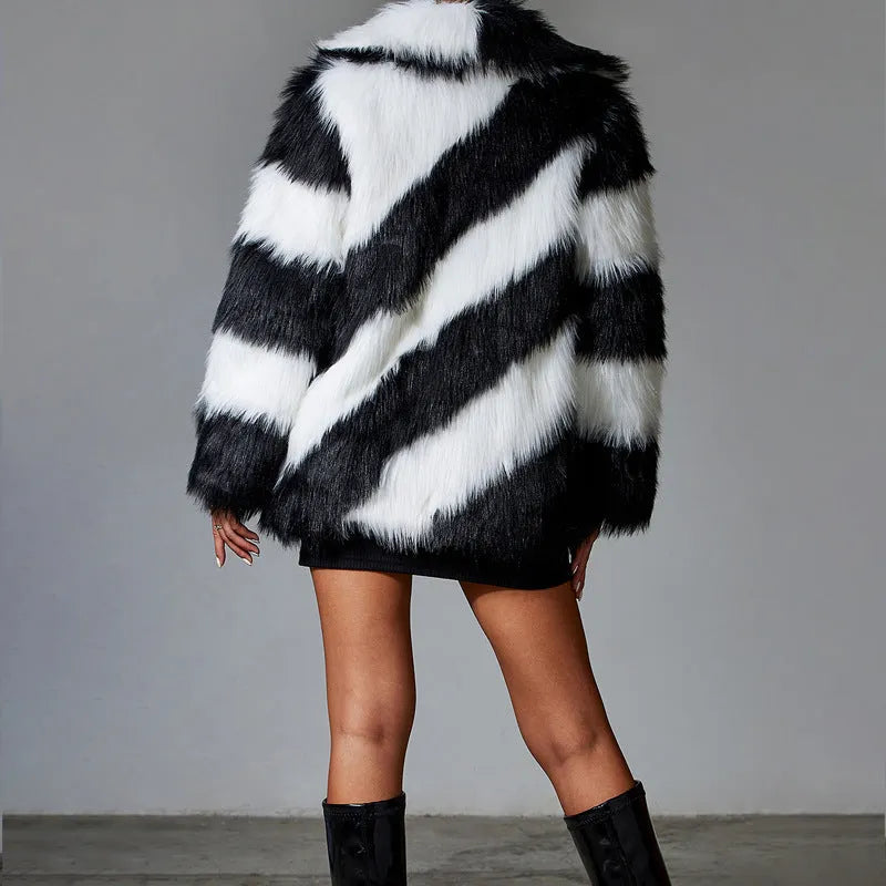 Women's faux fur coat with contrast lapel and detachable fur collar on a hanger.
