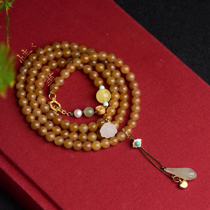 Green pine leaf jade bracelet with 6mm round beads in beeswax clear water colour